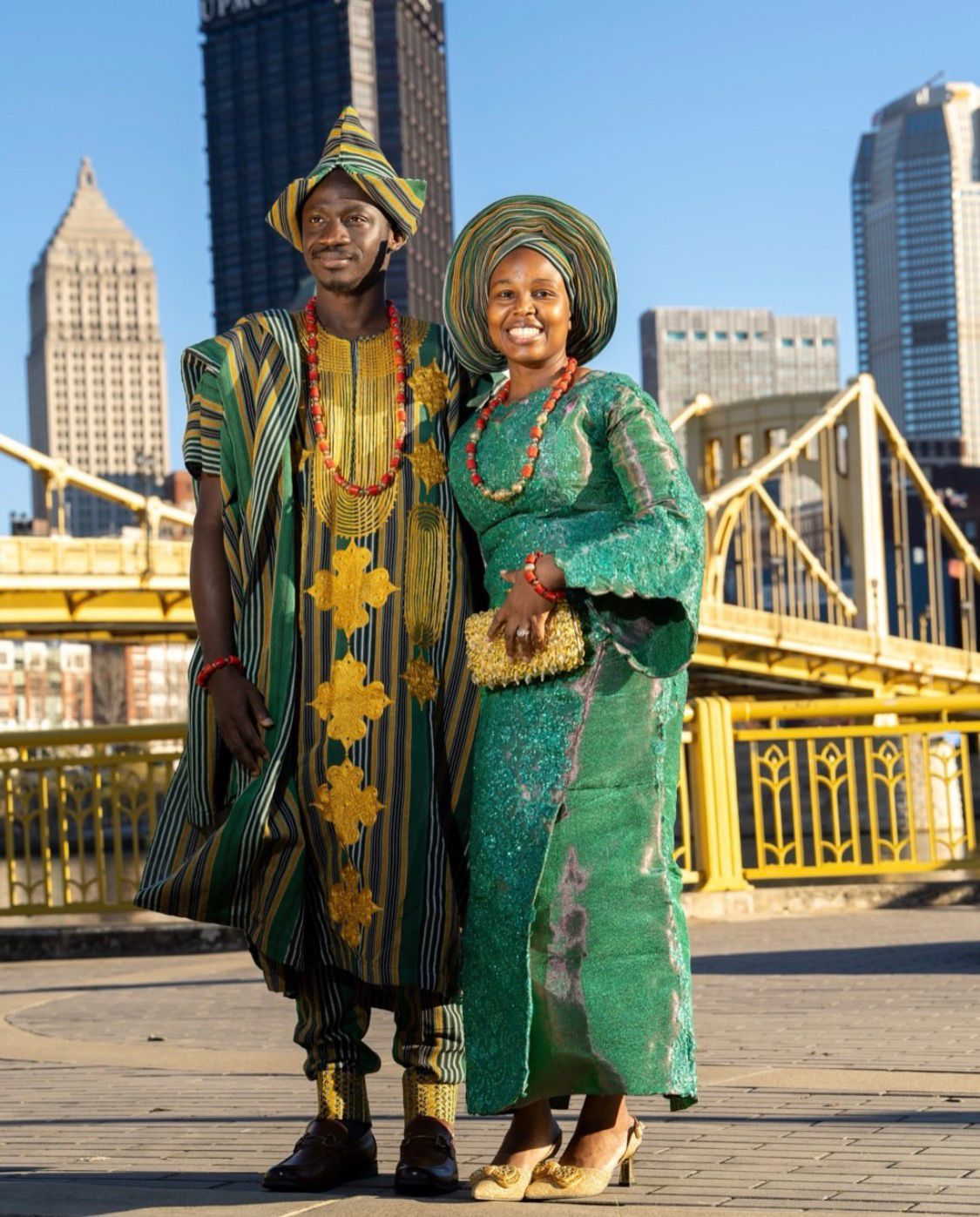 Couple in traditional African attire at Pittsburgh bridge